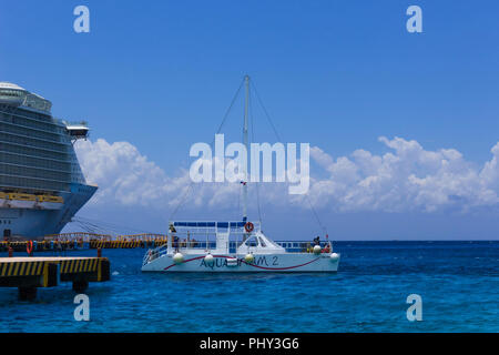 Cozumel, Mexico - May 04, 2018: tourists on ferry boat in blue caribbean water at Cozumel, Mexico Stock Photo
