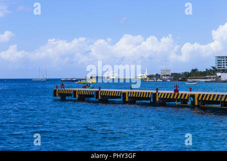 The coastline and port with blue caribbean water at Cozumel, Mexico Stock Photo