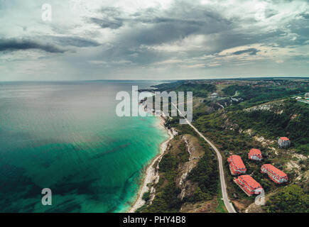 Panoramic view over golf fields next to the sea cliffs, aerial drone view. Stock Photo