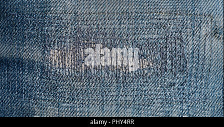 close up patch old jeans denim texture and background. Stock Photo