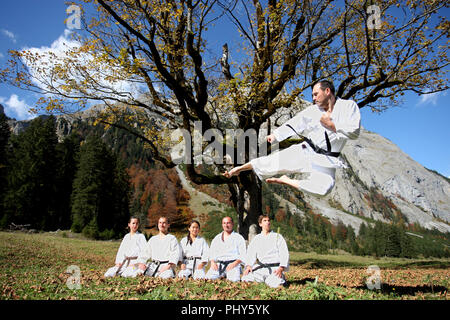 Members of Munich Karate Club USC show their sport at the big maple ground in the Karwendel Alps, Austria Stock Photo