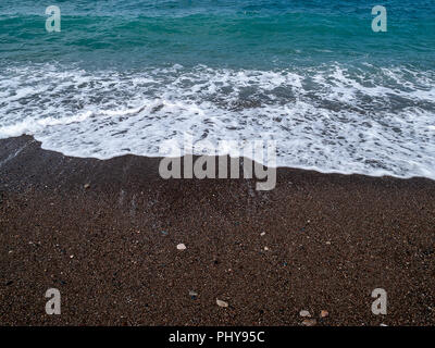 The black sand beach at Wadi Qandil. Mediterranean Sea, Syria. Stock Photo