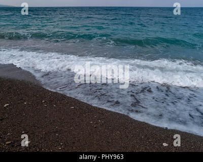 The black sand beach at Wadi Qandil. Mediterranean Sea, Syria. Stock Photo