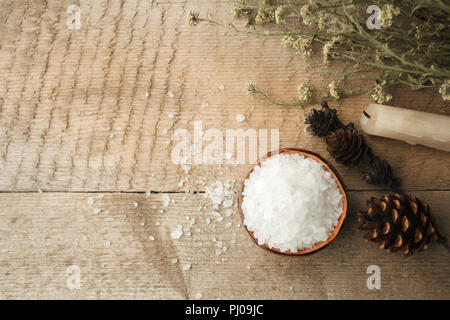 Spa composition on wooden table. Natural aroma candle, sea salt on rustic wooden background. Healthy skin care. SPA concept. Top view with space for t Stock Photo