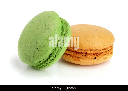 orange and green macaroon isolated on white background closeup. Stock Photo