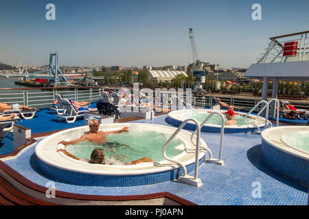 Portugal, Porto, Matosinhos, Leixoes Harbour, MV Marco Polo, passengers in jacuzzis of MV Marco Polo in sunshine Stock Photo