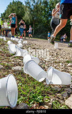 Discarded plastic water cups dropped by running competitors in the Sherwood Pines 10k.. Stock Photo