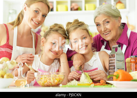 Portrait of a mom and daughters cook Stock Photo