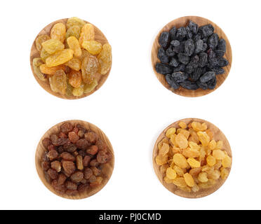 Collection of raisins in wooden bowl isolated on a white background. Top view. Flat lay Stock Photo