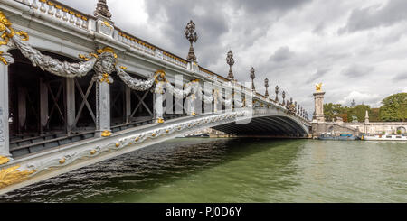 Ornate, late 19th-century arched bridge known as Pont Alexandre III, which crosses over the river seine in Paris