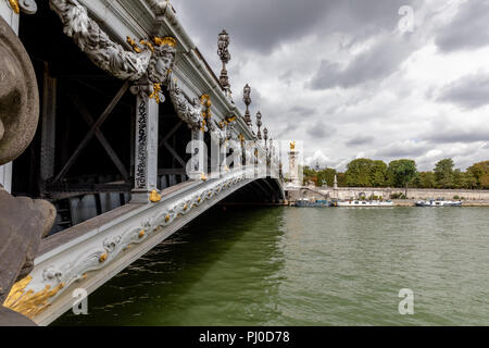 Ornate, late 19th-century arched bridge known as Pont Alexandre III, which crosses over the river seine in Paris