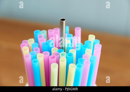 reusable stainless steel straw with disposable straws Stock Photo