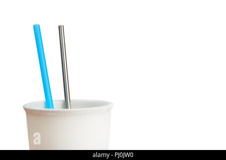 reusable stainless steel straw and disposable straw in a cup, isolated on white Stock Photo