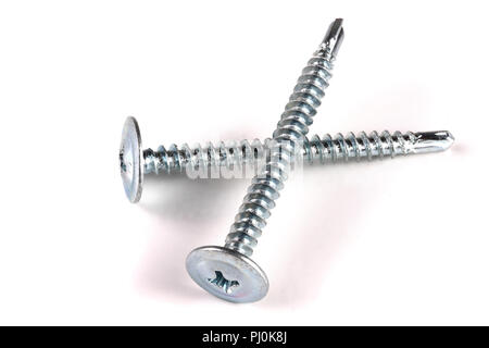 two metal screws isolated on white background closeup. Stock Photo