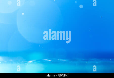 surface of water with bokeh on blue background Stock Photo