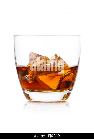 Glass of whiskey with ice cubes on white background. Cognac and brandy drink Stock Photo