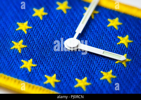Watch hands on EU flag, end of changing clocks in the EU Stock Photo