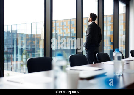 Successful Businessman by Window Stock Photo