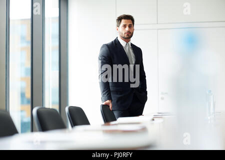 Businessman Alone in Office Stock Photo