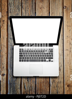 Modern laptop device from above on wooden table. Clipping path for laptop and screen Stock Photo