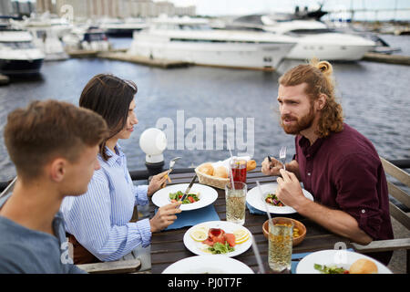 Having lunch by waterside Stock Photo
