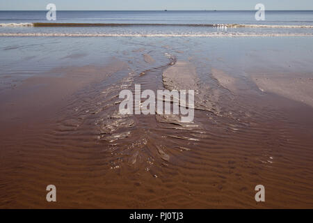 Ripples in the sand at low tide. Stock Photo