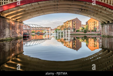Under the Castlefield Viaduct looking across the Bridgewater Canal  towards the Merchant's Bridge in Manchester Stock Photo
