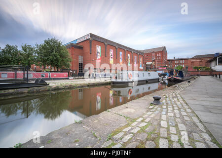 View from the towpath by the Bridgewater Canal in Castlefield, Manchester, looking towards narrowboats and MOSI Stock Photo