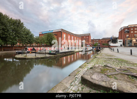 View from the towpath by the Bridgewater Canal in Castlefield, Manchester, looking towards narrowboats and MOSI Stock Photo