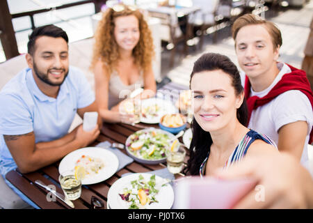 Friends Taking Selfie in Cafe Stock Photo