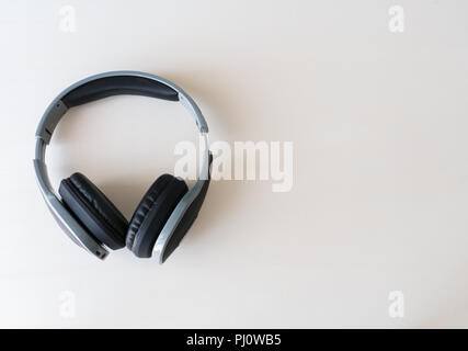 Earphone on white wooden background, Stock Photo