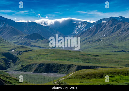 View of the Alaska Range mountains from Eielson Visitors Center in Denali National Park as storm clouds roll in over the mountain peaks Stock Photo