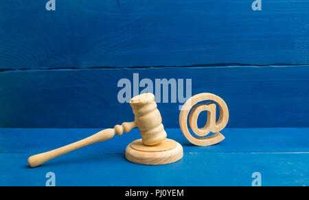 Judge's hammer and email address. The concept of legal proceedings for the seizure of rights to use the names of mail and websites. Confiscation of do Stock Photo