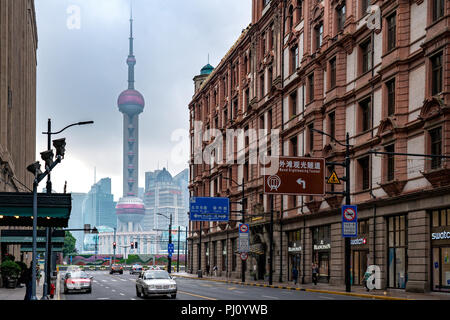 Early morning walk down East Nanjing Road, ends with a gorgeous view of the Oriental Pearl Tower in Shanghai, just outside the Fairmont Peace Hotel. Stock Photo