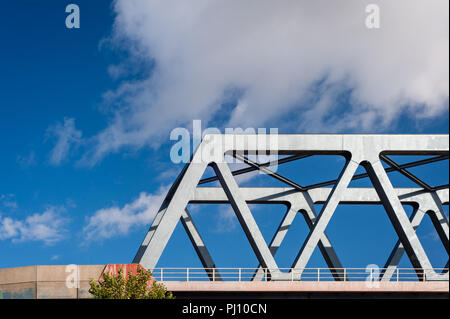 Detail of railway bridge with metal construction showing lines of force on sunny day in Hamburg, Germany. Stock Photo