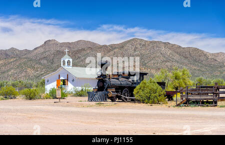 Old steam train in front of Church in Old Tucson Stock Photo