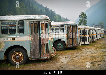 Sandon Buses, British Columbia. Sandon, British Columbia/Canada – August 24 2018:Old buses parked in the Kootenay ghost town of Sandon, BC. Stock Photo