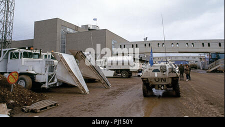 3rd March 1993 During the Siege of Sarajevo: a French Panhard VBL (Véhicule Blindé Léger or Light Armoured Vehicle) approaches a couple of French UN soldiers at Sarajevo Airport. Stock Photo