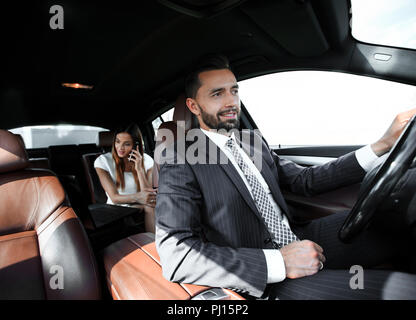 Attractive elegant serious man drives good car Stock Photo