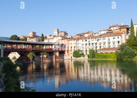 Ponte degli Alpini or Ponte Vecchio, Brenta River, Bassano del Grappa, Vicenza, Italy at sunset with reflections. Wooden pontoon bridge, Palladio 1569 Stock Photo