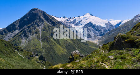 Man hiking towards the Dart River Valley, Mt Aspiring National Park, South Island, New Zealand Stock Photo