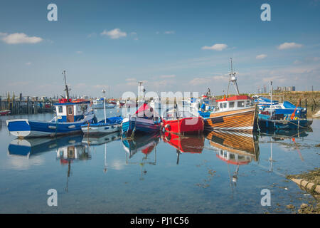 Small fishing boats in Paddys Hole on South Gare which was named for the many Irishmen who helped build the South Gare. Stock Photo