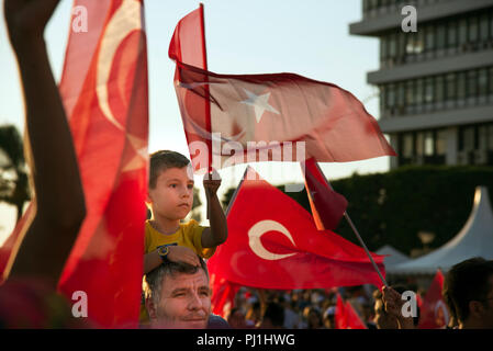 Izmir, Turkey - June 15, 2018: June 15 Day of Democracy in Turkey Izmir. Boy with a Turkish flag and on his father's shoulders. Stock Photo