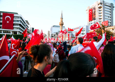 Izmir, Turkey - June 15, 2018: June 15 Day of Democracy in Turkey Izmir. People holding Turkish flags at Konak square in Izmir and in front of the his Stock Photo