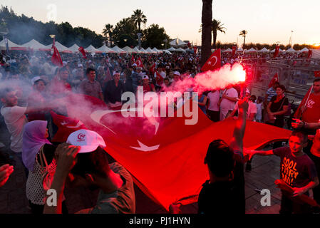 Izmir, Turkey - June 15, 2018: June 15 Day of Democracy in Turkey Izmir. People holding Turkish flags at Konak square in Izmir and in front of the his Stock Photo