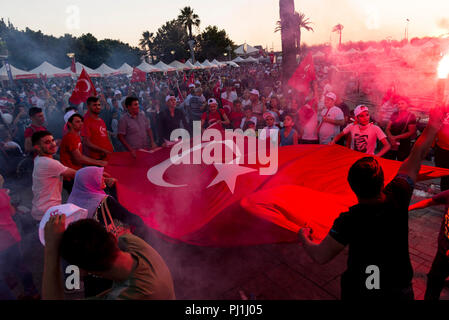 Izmir, Turkey - June 15, 2018: June 15 Day of Democracy in Turkey Izmir. People holding Turkish flags at Konak square in Izmir and in front of the his Stock Photo