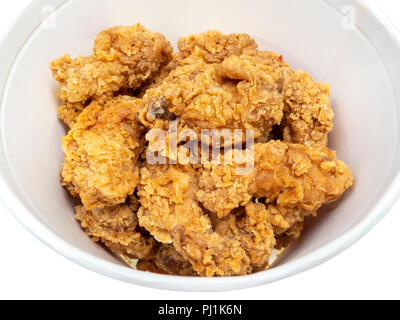 roasted spicy chicken wings close up in bucket cut out on white Stock Photo