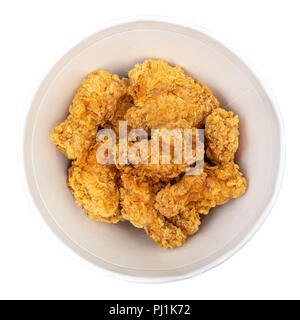 top view of roasted spicy chicken wings in bucket cut out on white Stock Photo