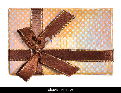 top view of shiny yellow gift box tied by brown ribbon with bow isolated on white background Stock Photo