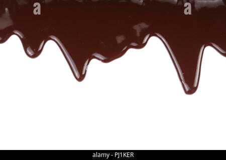 Melted chocolate dripping isolated on white background. Stock Photo